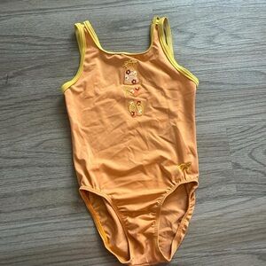 Orange gymnastics leotard